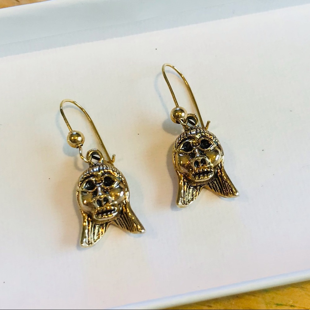 Vintage gold tone shrunken head drop earrings